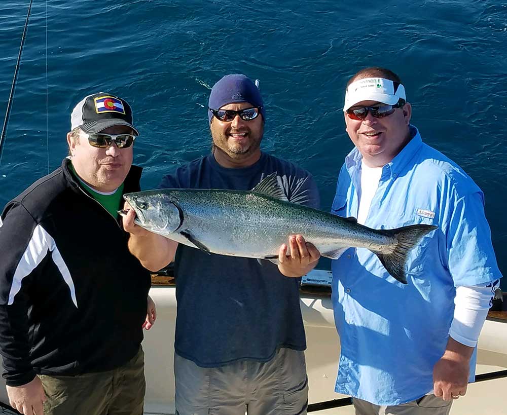 catching-a-salmon-on-a-fishing-charter