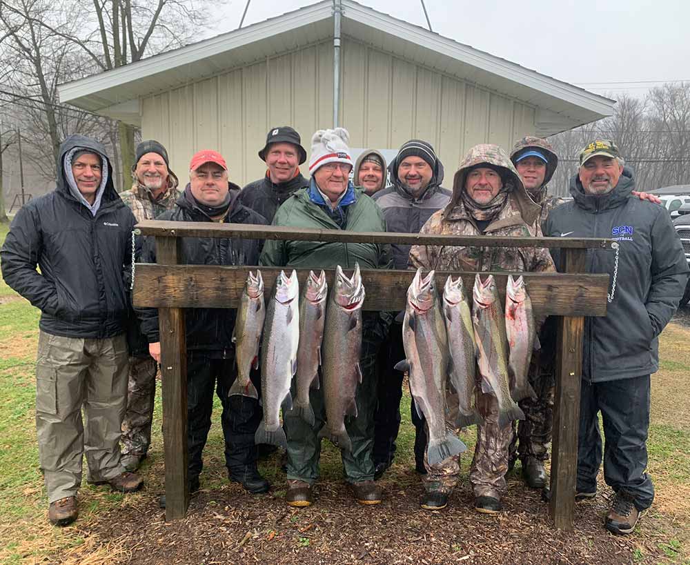group-of-people-taking-picture-with-fish-caught-on-a-fishing-charter